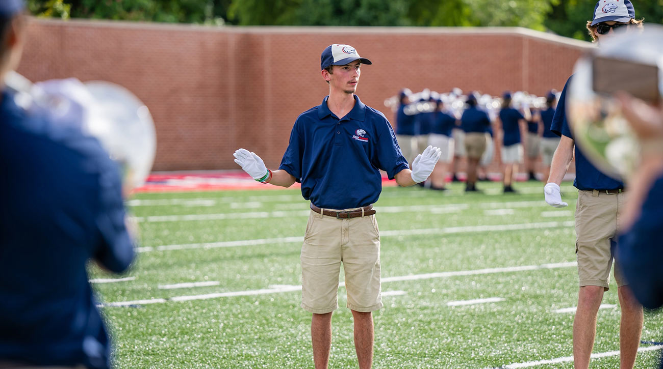 Jaxson on band field leading band.